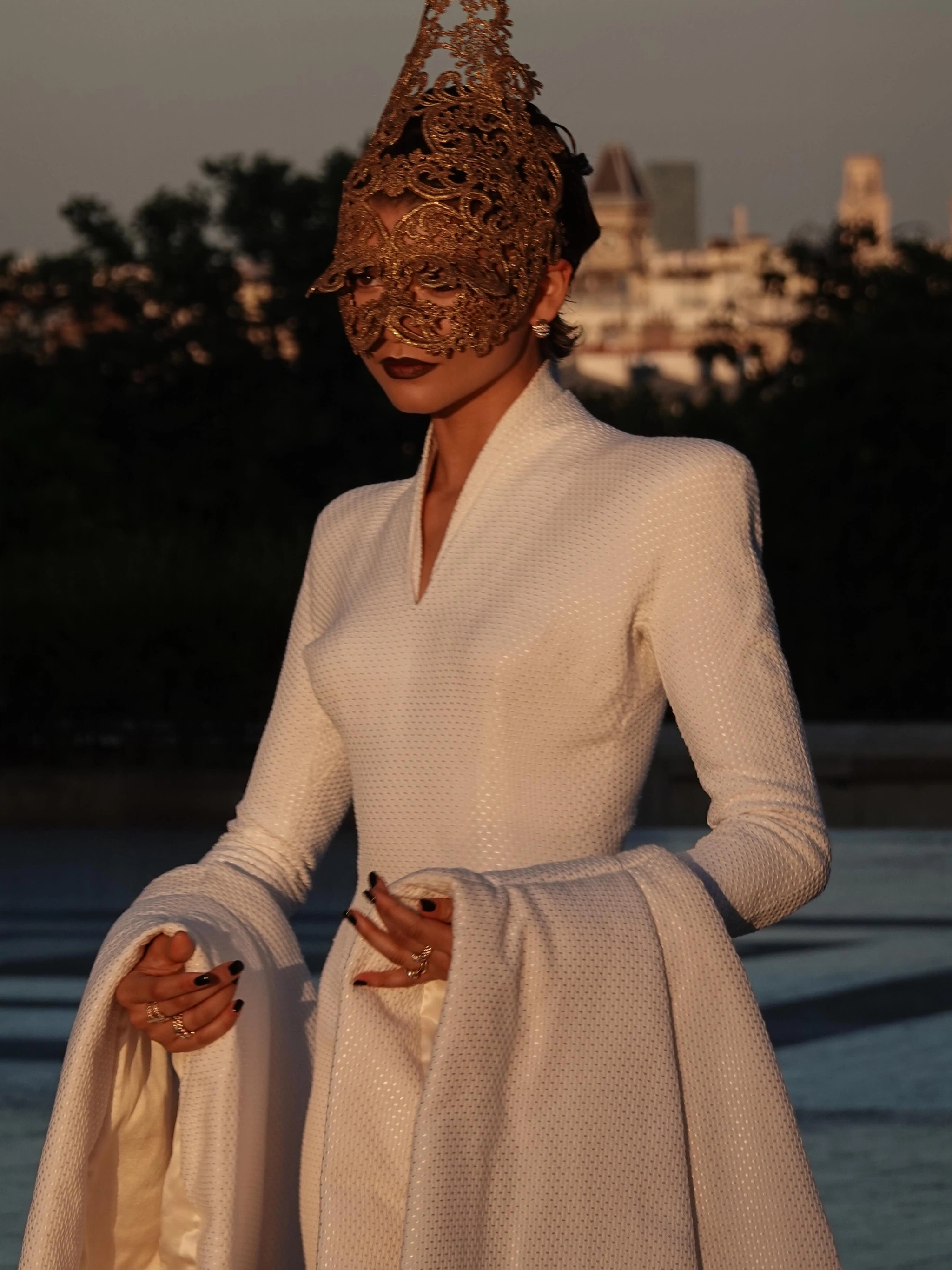 Zendaya at The Odyssey Paris photocall wearing an archival Alexander McQueen for Givenchy Spring 1997 white structured dress and Philip Treacy gold filigree lace headpiece, with Fope gold rings, July 2026